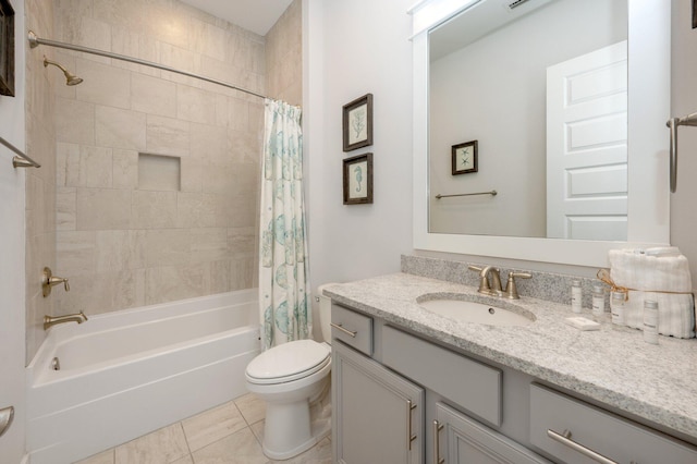 full bathroom featuring tile floors, toilet, shower / bath combination with curtain, and vanity