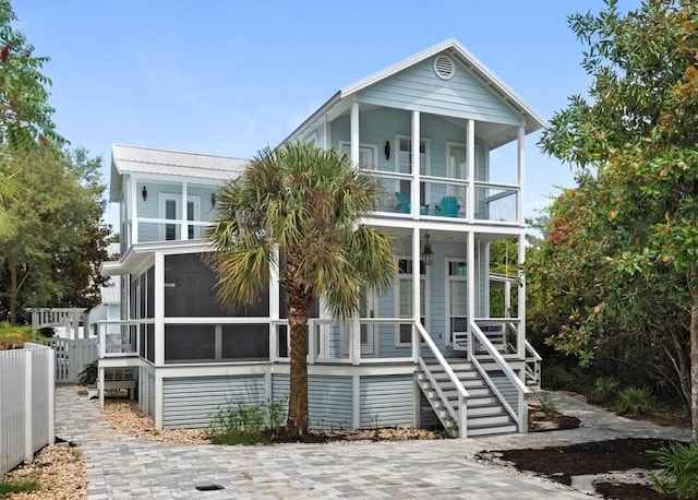 view of front of house with covered porch and a balcony