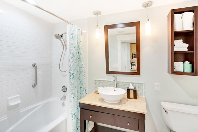 full bathroom featuring shower / tub combo, vanity, toilet, and backsplash