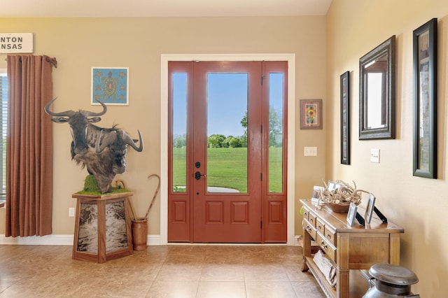 tiled foyer entrance featuring a healthy amount of sunlight