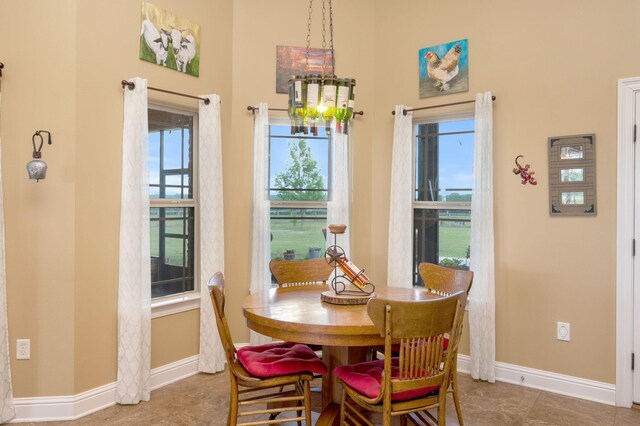 dining room featuring tile patterned floors and plenty of natural light