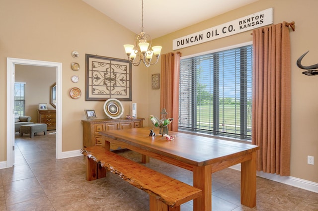 dining room featuring lofted ceiling, a chandelier, and light tile patterned floors