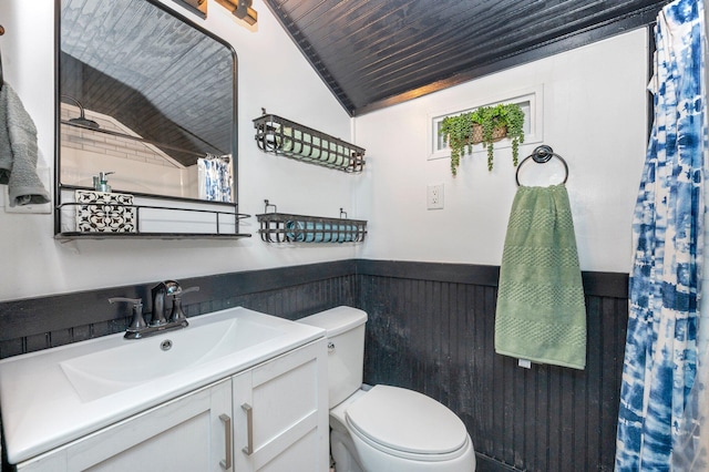 bathroom with wooden ceiling, lofted ceiling, vanity, and toilet