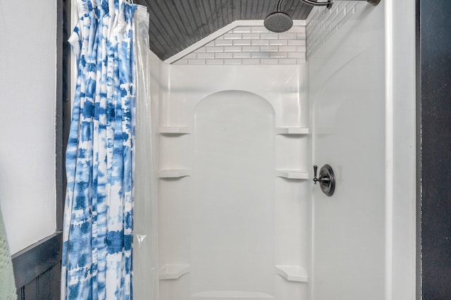 bathroom featuring a shower with curtain