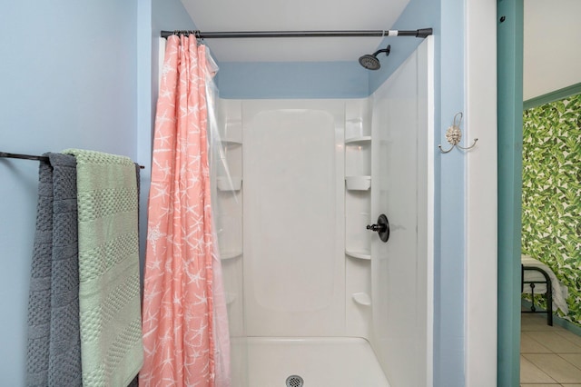 bathroom featuring a shower with shower curtain and tile flooring