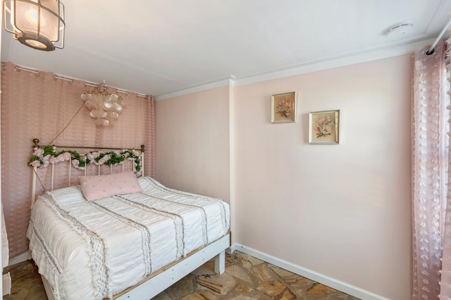 tiled bedroom featuring crown molding