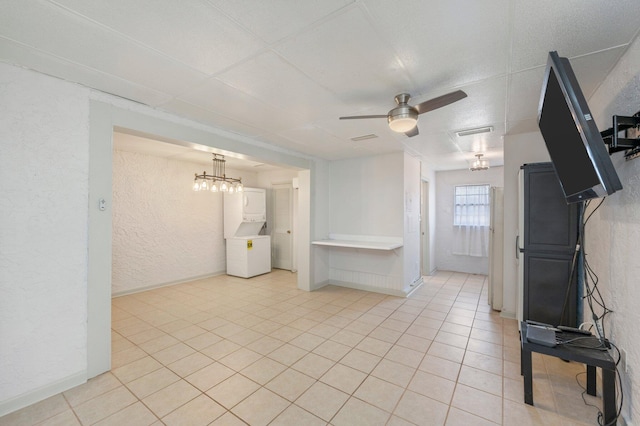 unfurnished living room featuring ceiling fan and light tile flooring