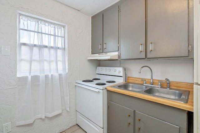 kitchen with sink, white range with electric stovetop, gray cabinetry, and light tile flooring