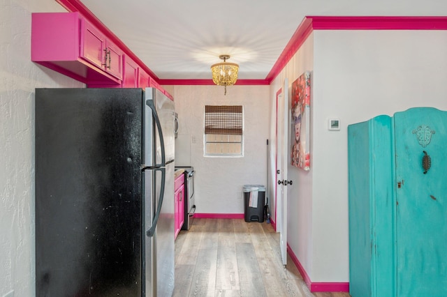 kitchen featuring light hardwood / wood-style floors, refrigerator, crown molding, and stainless steel electric stove