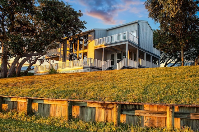 view of back house at dusk