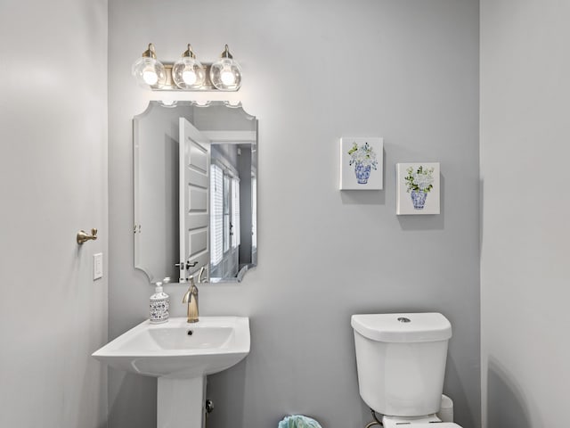 bathroom with sink and toilet