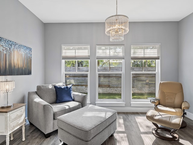 living room featuring hardwood / wood-style flooring and a chandelier