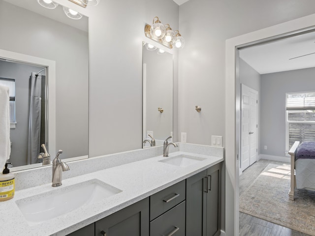 bathroom with large vanity and double sink