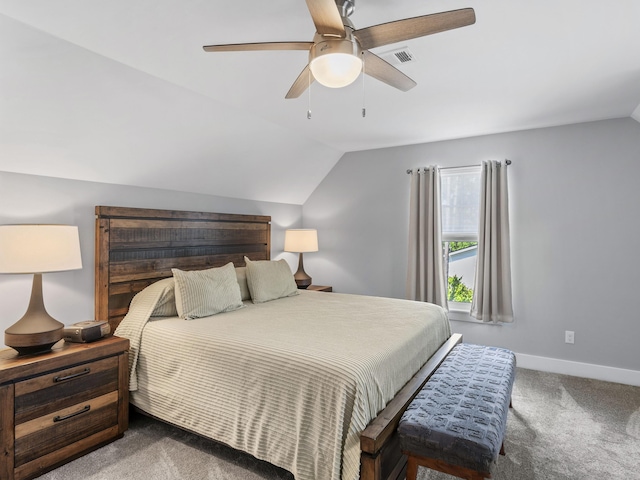 bedroom featuring ceiling fan, dark carpet, and lofted ceiling