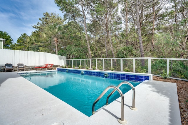 view of swimming pool with a patio area and pool water feature