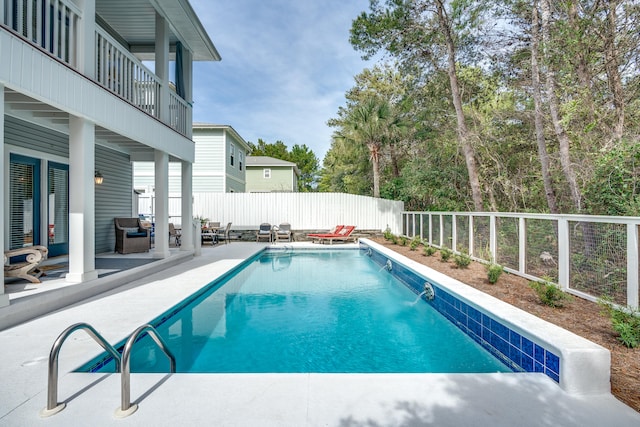 view of swimming pool featuring a patio area and pool water feature