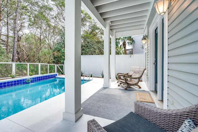 view of pool featuring a patio