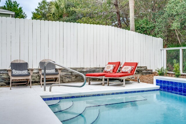 view of pool featuring a patio area