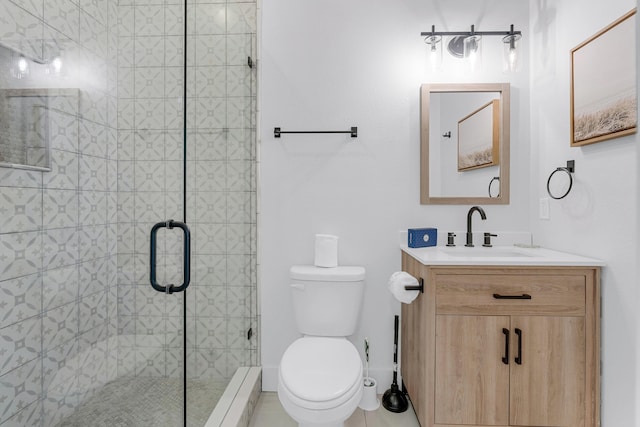 bathroom with vanity, toilet, a shower with door, and a baseboard heating unit