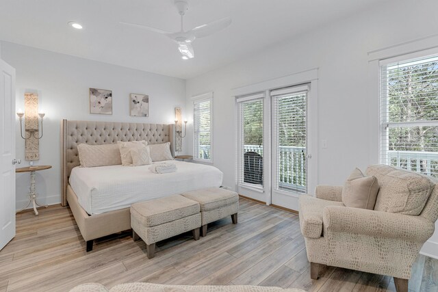 bedroom featuring ceiling fan, light wood-type flooring, and access to outside