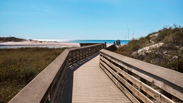 view of community with a view of the beach and a water view