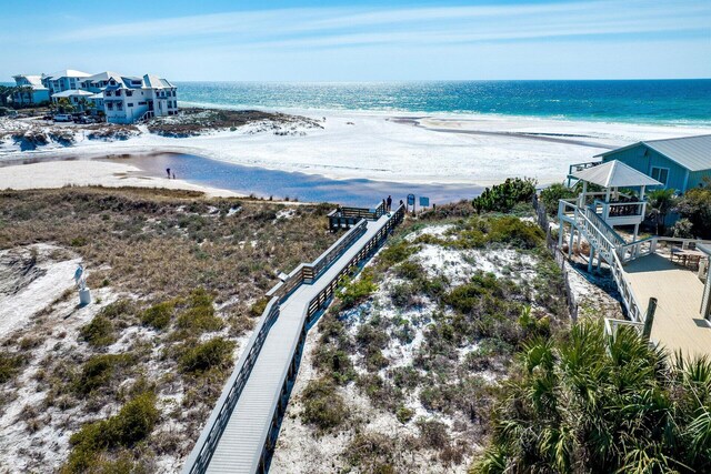 aerial view with a view of the beach and a water view