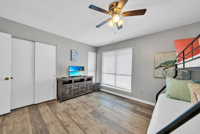 interior space with wood-type flooring and ceiling fan