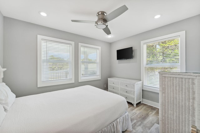 bedroom featuring ceiling fan and light wood-type flooring