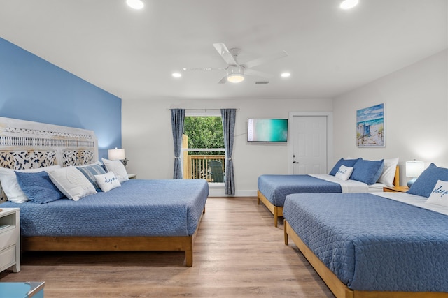 bedroom featuring access to outside, ceiling fan, and light wood-type flooring