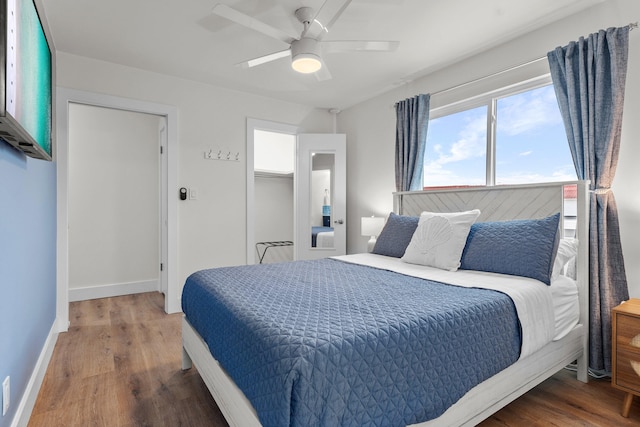 bedroom featuring dark hardwood / wood-style floors and ceiling fan