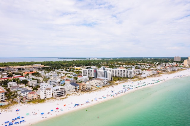 bird's eye view featuring a view of the beach and a water view