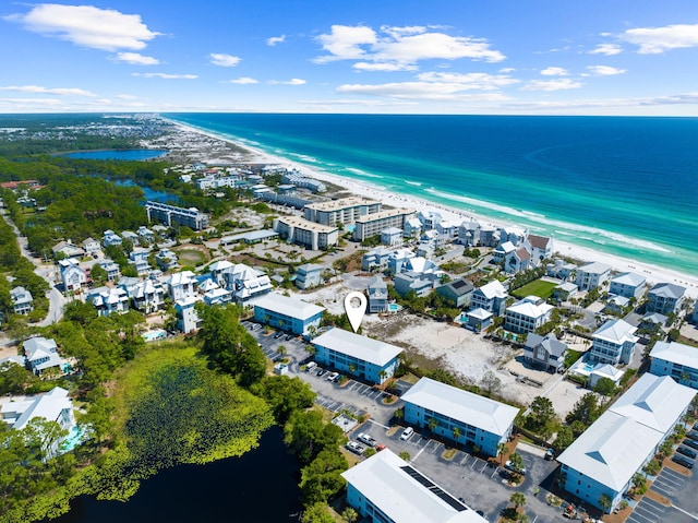 drone / aerial view with a water view and a view of the beach