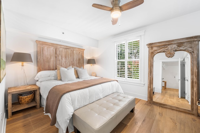 bedroom featuring light hardwood / wood-style floors and ceiling fan