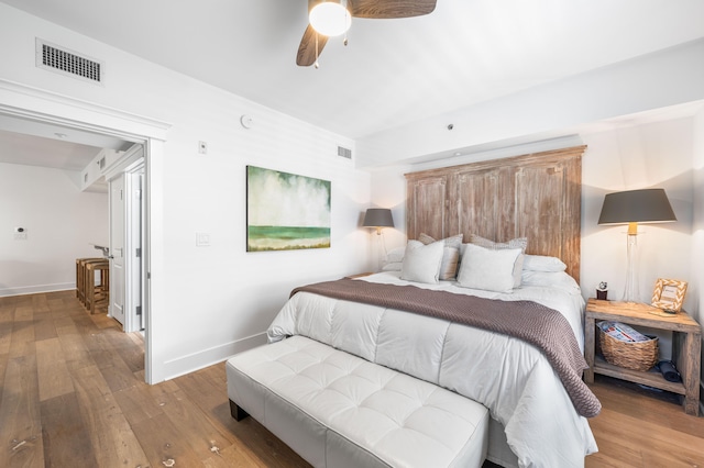 bedroom featuring light wood-type flooring and ceiling fan