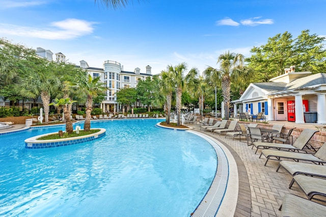 view of swimming pool with a patio area