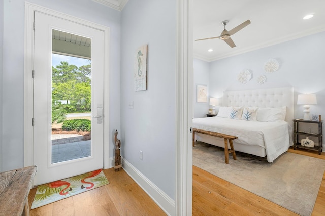 interior space with ornamental molding, light hardwood / wood-style flooring, and ceiling fan