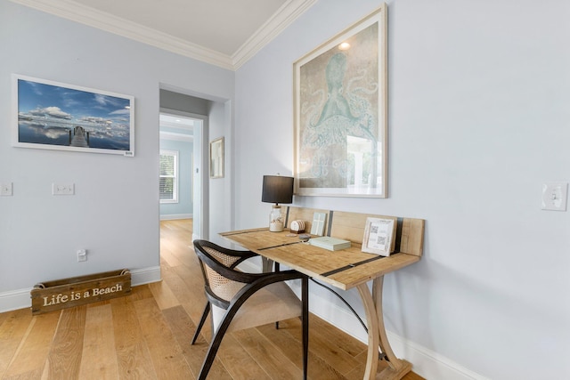 office space featuring ornamental molding and light hardwood / wood-style floors