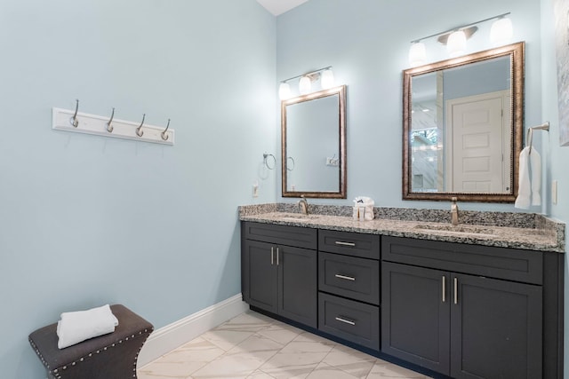 bathroom featuring dual bowl vanity and tile flooring