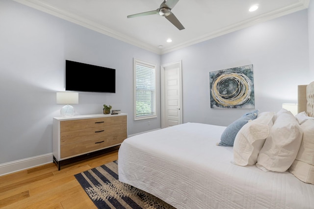 bedroom featuring ceiling fan, light hardwood / wood-style floors, and crown molding