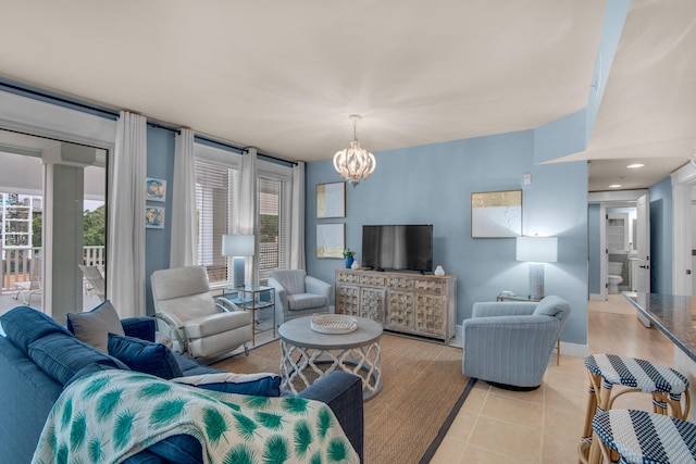 living room with a chandelier and light tile flooring