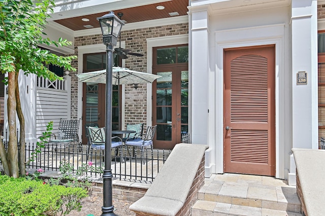 view of exterior entry featuring french doors