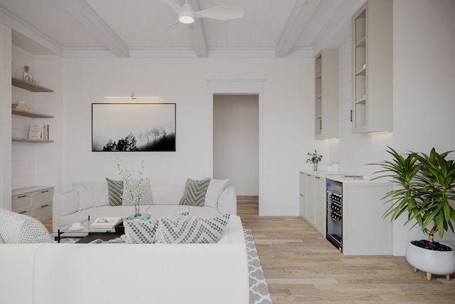 living room featuring light hardwood / wood-style floors, ceiling fan, beamed ceiling, and beverage cooler