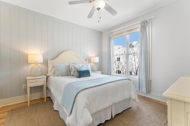 bedroom featuring wood-type flooring and ceiling fan