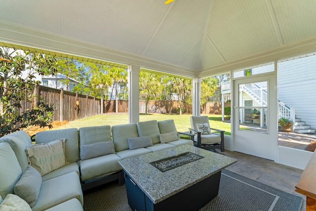 sunroom featuring lofted ceiling