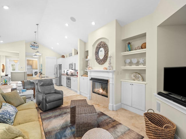 tiled living room with built in shelves, sink, and lofted ceiling