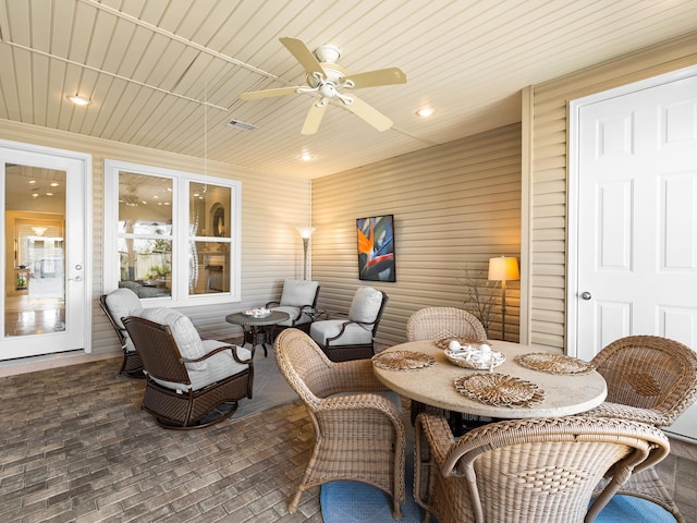 interior space featuring ceiling fan and wood ceiling