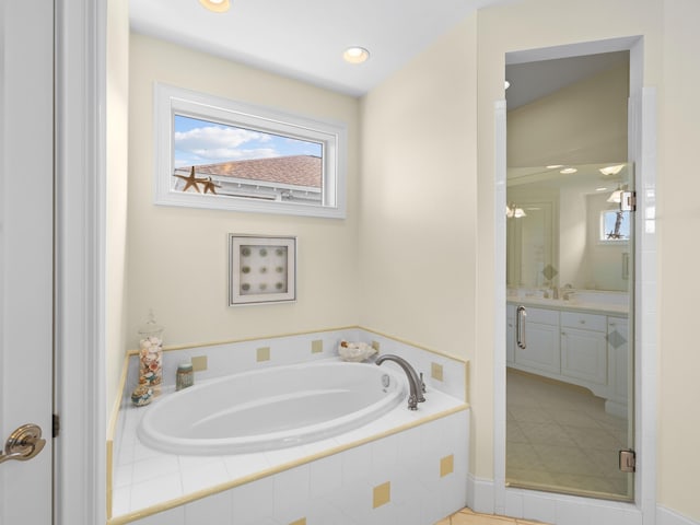 bathroom with vanity, separate shower and tub, and tile floors