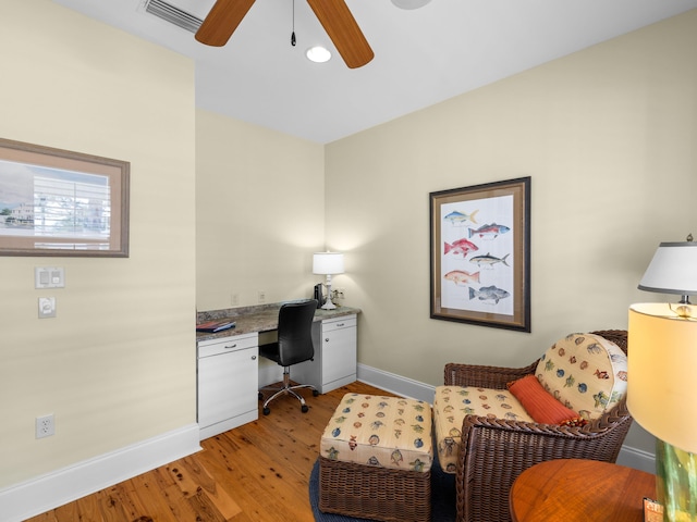 office space with ceiling fan and light wood-type flooring