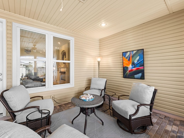 sitting room featuring wood ceiling