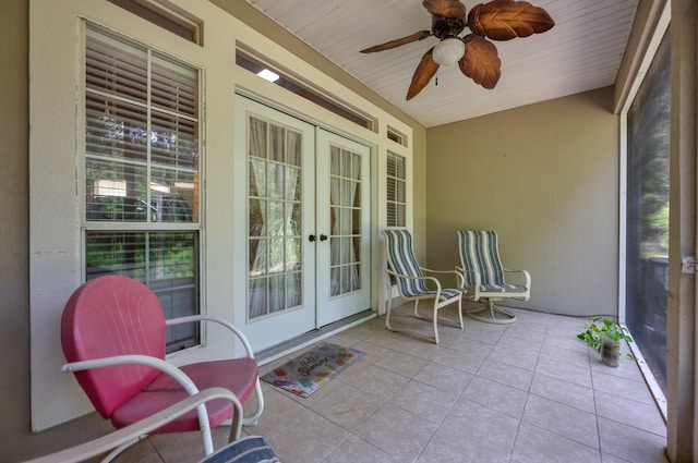 sunroom / solarium with ceiling fan, french doors, a wealth of natural light, and wooden ceiling